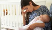 Tired Mother Suffering From Post Natal Depression