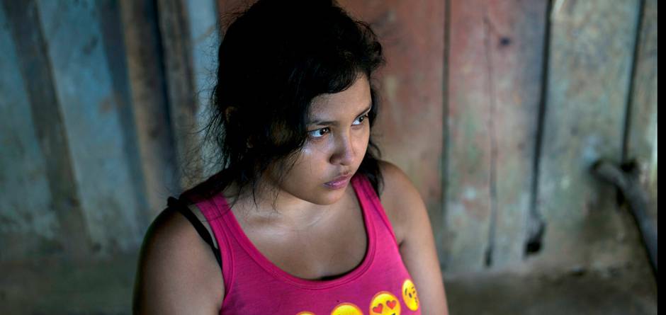 Jackie, 17, Alexis' sister, in the family house in Omoa, Honduras on June 27th, 2016. She also wants to migrate, in spite of what happened to her brother: "It terrifies me. It terrifies me just to think about it. But it also terrifies me to live this life, knowing there is no hope. At least I can take the risk, and have some hope." Alexis, his mother and five siblings live in extreme poverty, in a wood and corrugated iron shack built on a slope that turns into mud every time it rains. Alexis, mother Mercedes, and the teenage children work odd jobs when they can find them harvesting cocoa pods or chiles. Two older siblings who work and live in nearby towns help out as much as they can. Mercedes said "Alexis had left because of poverty. He told me he was going so he could help me and all the children I have. He wanted to study." At the age 16, Alexis and a cousin packed their meager belongings and hit the road, hoping to escape the bitter poverty in which they grew up in Honduras. Like hundreds of thousands of others from Central America, they hoped to make it to the United States. But for Alexis, the journey ended in Mexico, when he fell off a freight train and lost his right leg - not an uncommon injury on the notorious route. Now, he is back home - a wood and corrugated iron shack built on a slope that turns into mud every time it rains. His mother and his teenage siblings work odd jobs when they can find them, harvesting chilies, taking care of other people's children or helping out in food stalls. Getting to the United States, was about more than just "an American dream," says Alexis. "It's about getting out of the country, which has so much poverty. I wanted to get there and work and help my brothers and my mother." Alexis sometimes joins a local UNICEF-supported outreach group to tell other young people about the dangers of the journey. But he's convinced his own siblings will eventually try to head north. "For the same reason I left here, my brothers and